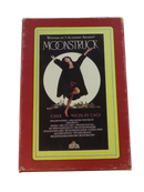 Front of the red oversized Moonstruck Blockbuster-style display box showing Cher, Nicolas Cage, MGM/UA Home Video logo, and visible edge wear.