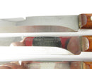 Six Imperial Diamond Edge steak knives with smooth stainless blades and contoured wood handles, reverse side view.