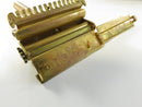Angled side view of closed brown metal razor tin with paint loss and surface wear