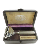 Open GEM leatherette presentation case with Damaskeene safety razor and small blade box inside.