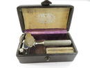 Open empty leatherette case interior showing the lined compartments and small blade box.