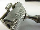 Close view of the GEM razor head, blade guard, and knurled handle.