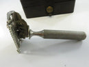 Open razor head and comb mechanism in front of the closed GEM case.