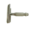 Close side view of the Gillette travel safety razor with knurled handle, guard plate, and blade installed.