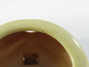 Close view of the upper front bezel showing the stem notch and blemish on the rim.