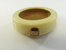 Disassembled celluloid bezel and rear panel with top stem notches visible.