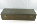 Underside view showing the aged paper bottom backing and worn exterior edges.
