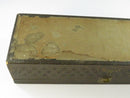Open antique glove box showing the fabric-lined interior, floral damask-patterned lid lining, and two rear brass hinges.