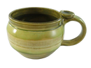 Green glazed studio pottery stoneware mug with rounded wide body, handle, and integrated thumb rest.
