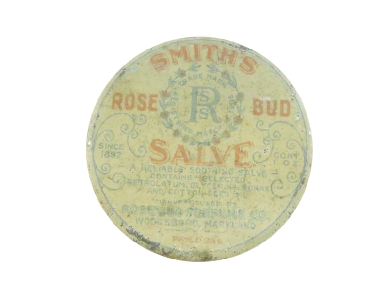 Round tin labeled 'Smith's Rose Bud Salve' on a white background