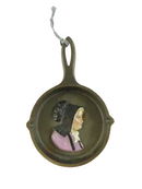 Vintage Cast Iron Miniature Skillet with Painted Amish Girl - 6 3/8" — front view