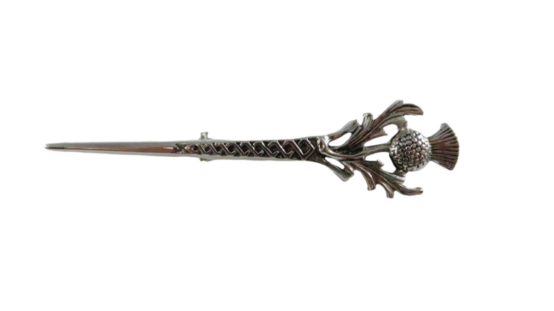 Decorative hairpin with thistle design on a white background