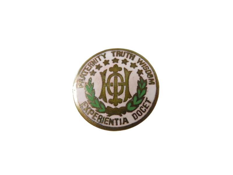 Pin with emblem and text on a white background