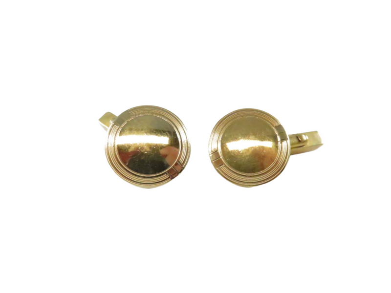 Gold round cufflinks on a white background