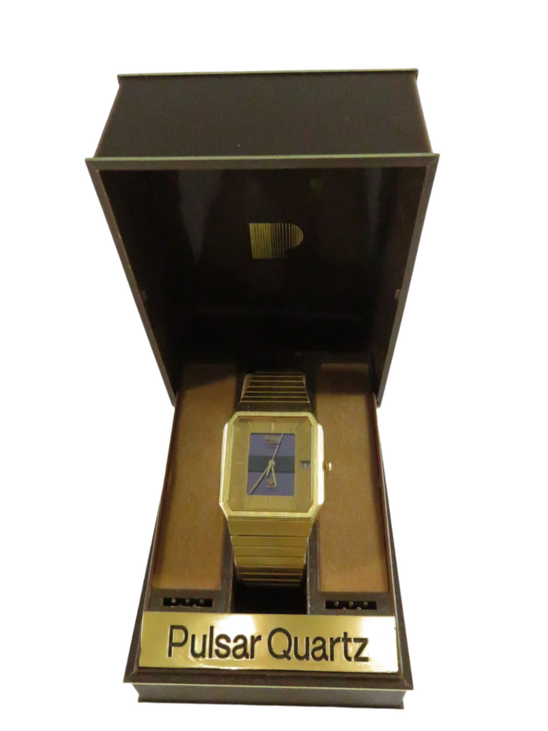 Gold wristwatch in a Pulsar Quartz box on a white background