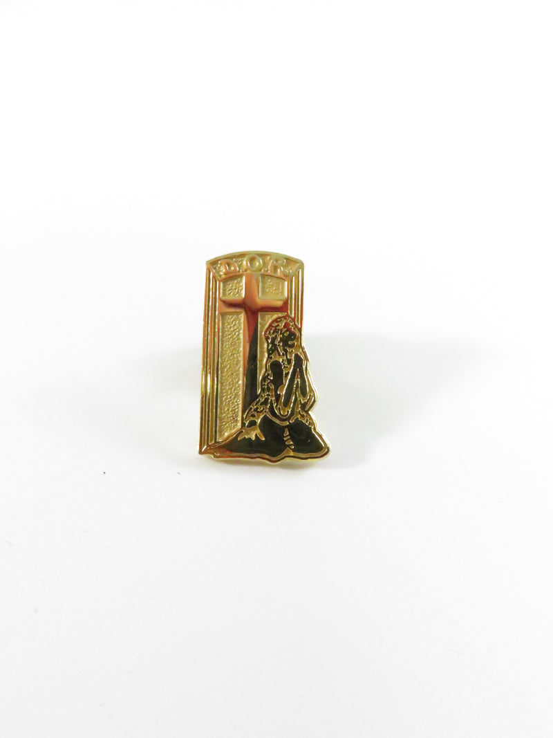 Praying figure at cross pinback lapel pin, gold tone religious window motif