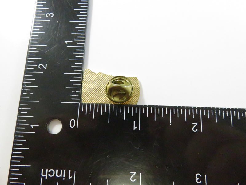 Praying figure at cross pinback lapel pin, gold tone religious window motif