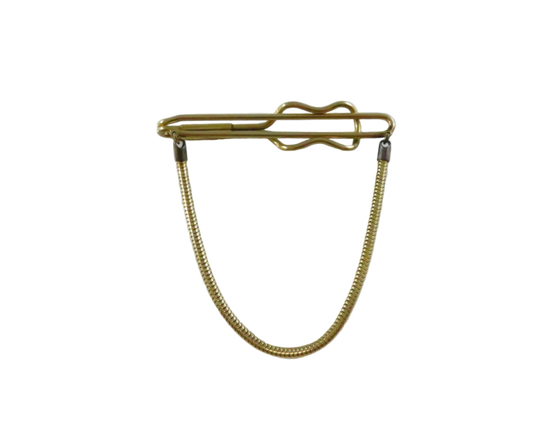 Gold tie clip with chain on a white background