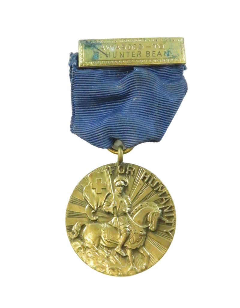 Gold medal with blue ribbon on a white background