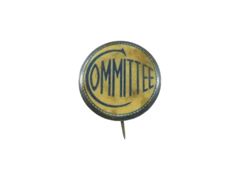 Vintage button badge with 'COMMITTEE' text on a white background
