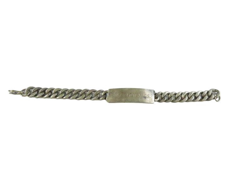 Silver chain bracelet with a tag on a white background