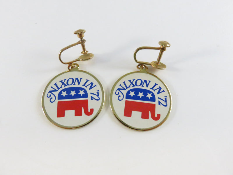 Pair of earrings with Nixon 1972 design on a white background