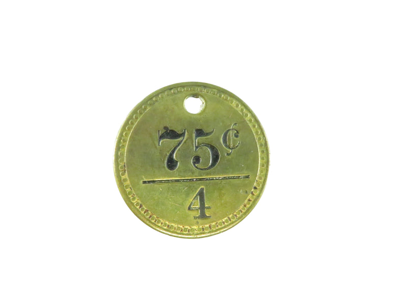 Gold-colored token with '75 cents' and '4' printed on a white background