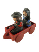Vintage Cast Iron Amish Children in Red Wagon – Miniature Folk Art Figural Set — front view