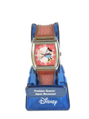 Disney character watch with pink strap and pink face on a white background