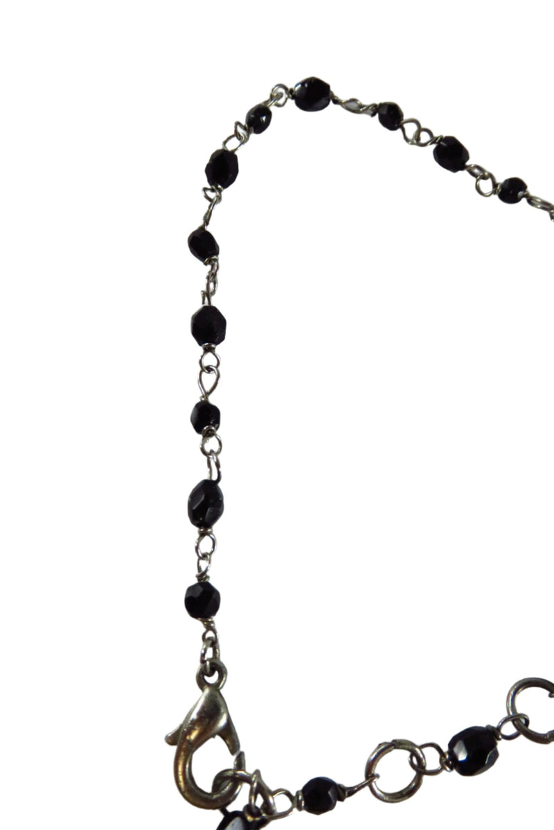 Beaded Dangling Cross Bracelet Black Faceted Glass Accents 11" TL close up of beads and clasp