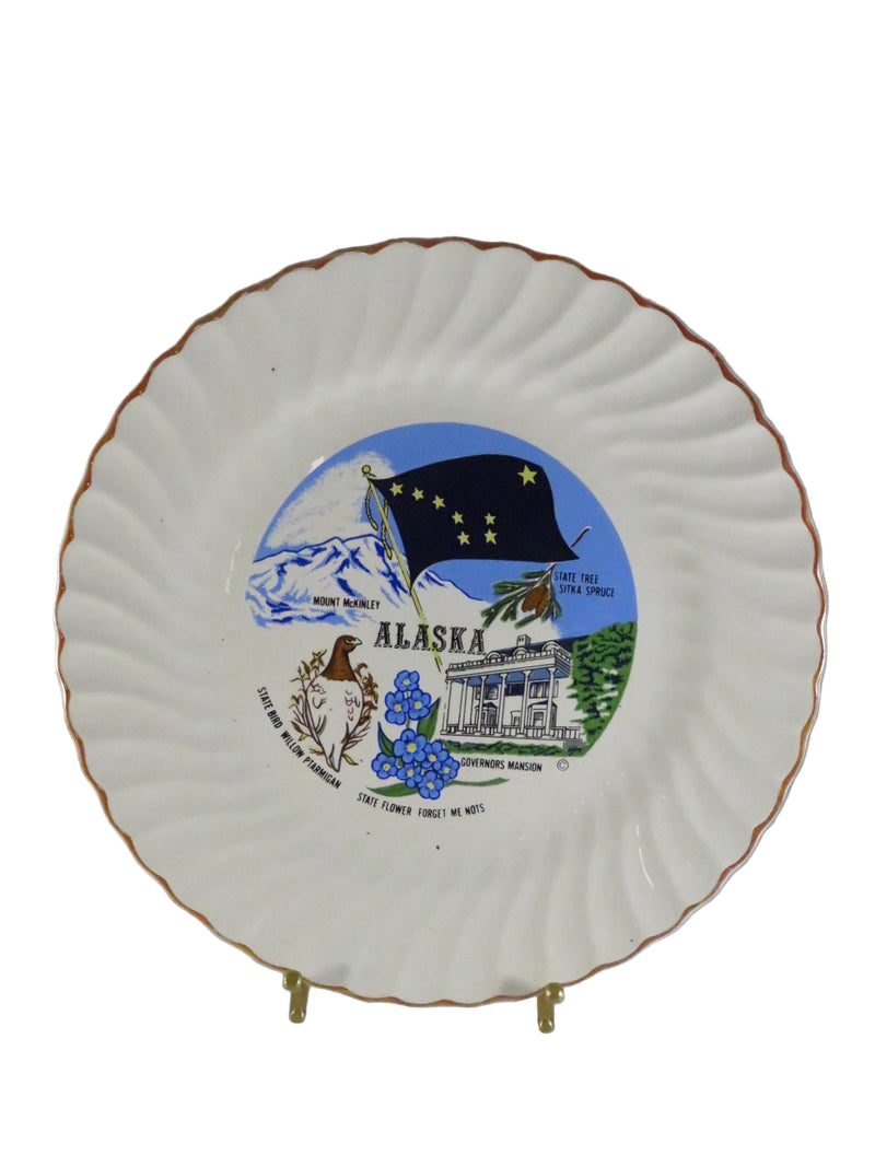 Decorative plate with Alaska-themed design on a plain background