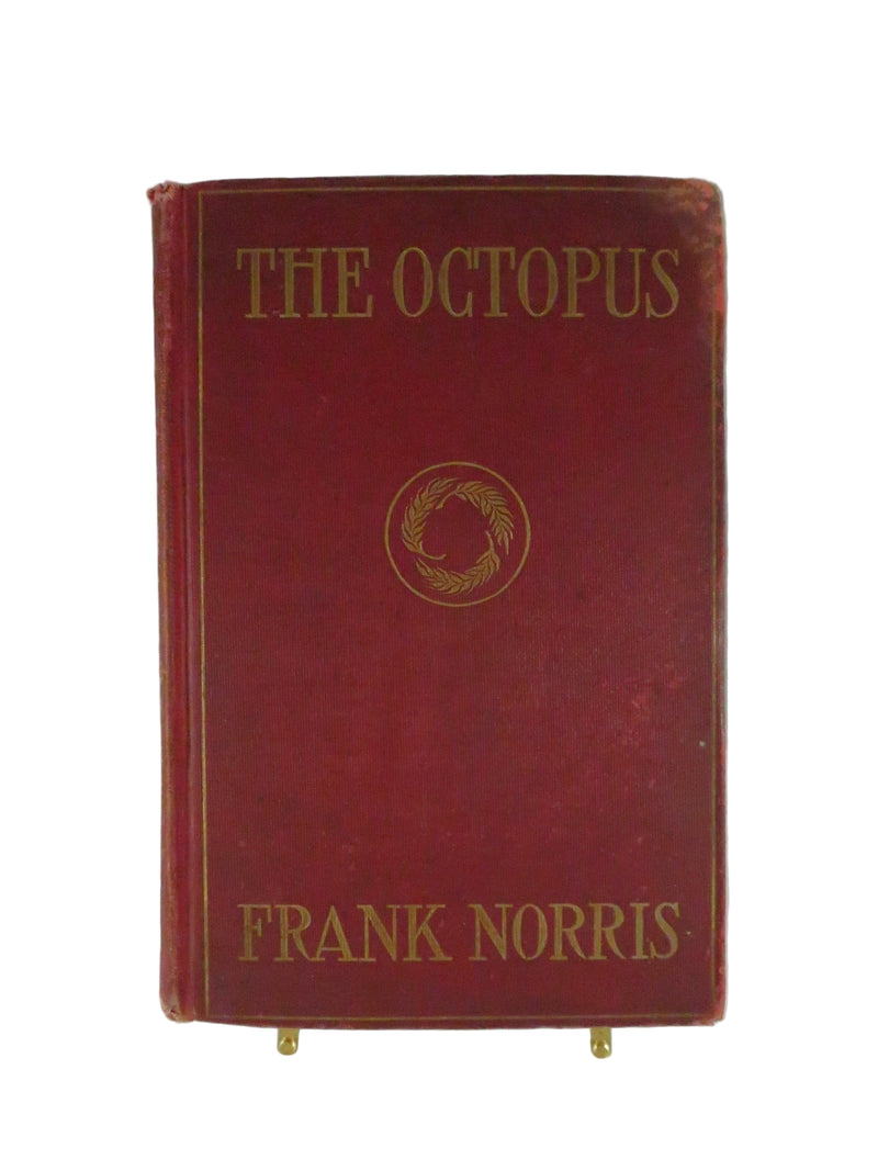 Red book titled 'The Octopus' by Frank Norris on a white background
