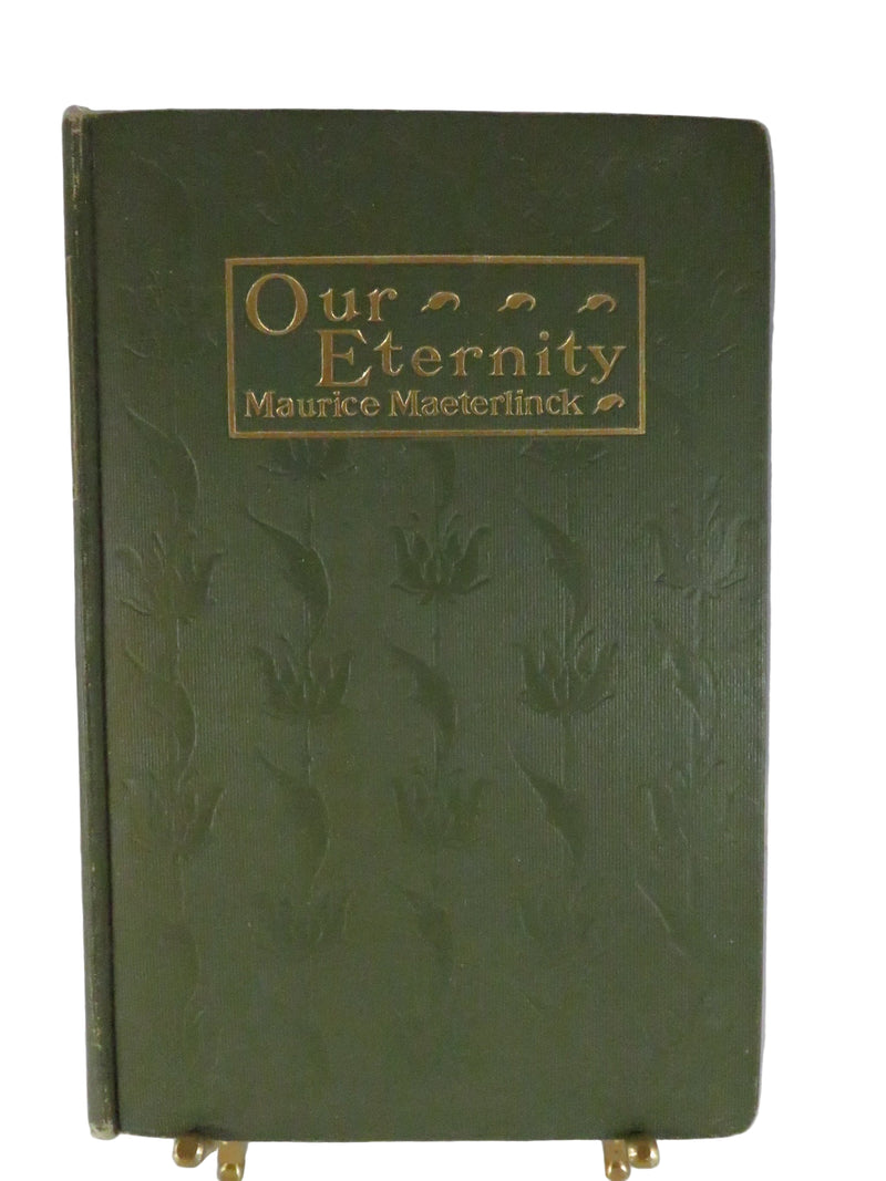 Green book with gold embossed text on a white background