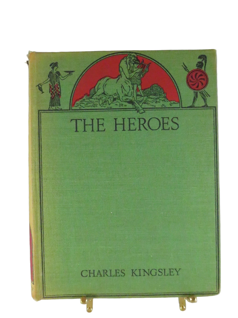 Book titled 'The Heroes' by Charles Kingsley with green cover and red circular design on a white background