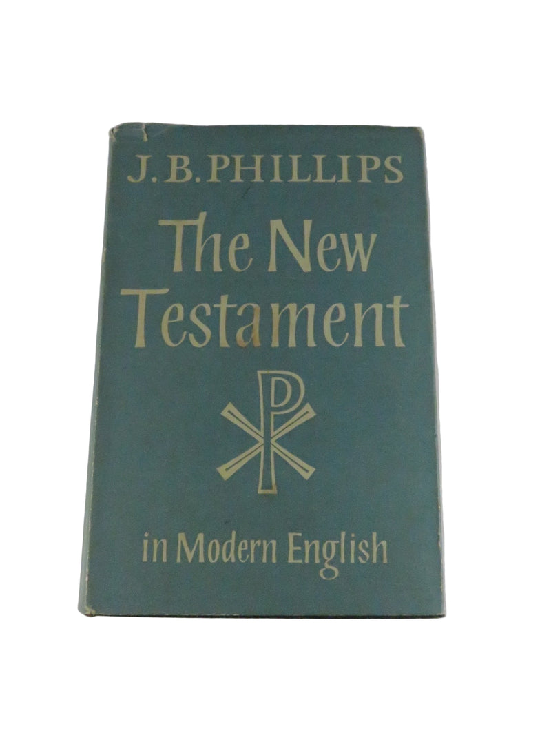 Green book titled 'The New Testament in Modern English' by J.B. Phillips on a white background