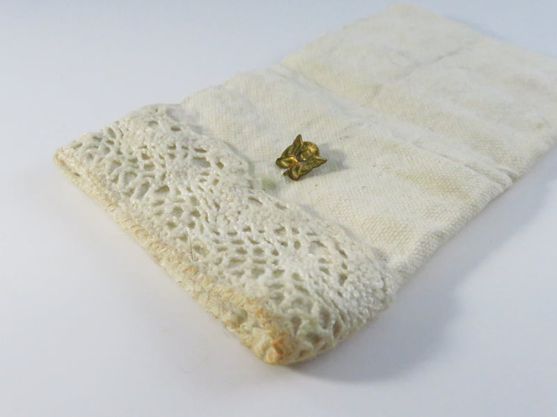 Vintage eyeglass pouch, heavy cloth with cherub brass-tone appliqué, approx. 6 1/2" x 3 1/2"