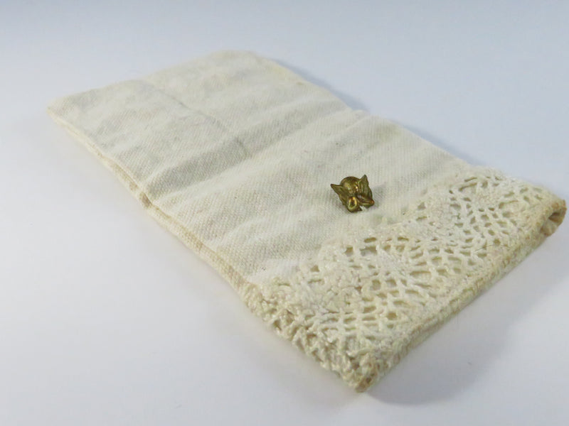 Vintage eyeglass pouch, heavy cloth with cherub brass-tone appliqué, approx. 6 1/2" x 3 1/2"