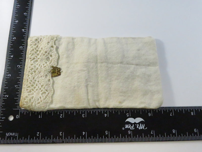 Vintage eyeglass pouch, heavy cloth with cherub brass-tone appliqué, approx. 6 1/2" x 3 1/2"