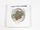 Round container with coins and 'KEEP THE CHANGE' text on a white background