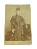 Vintage sepia-toned photograph of a woman, with 'E. H. Starr & Co.' brand