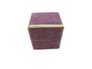 Purple textured jewelry box with gold trim on a white background