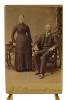 Antique Cabinet Card Woman By Photo Album and Seated Man J.L. Pinsonneault — front view