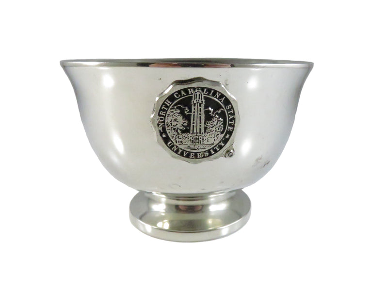 Silver cup with engraved emblem on a white background