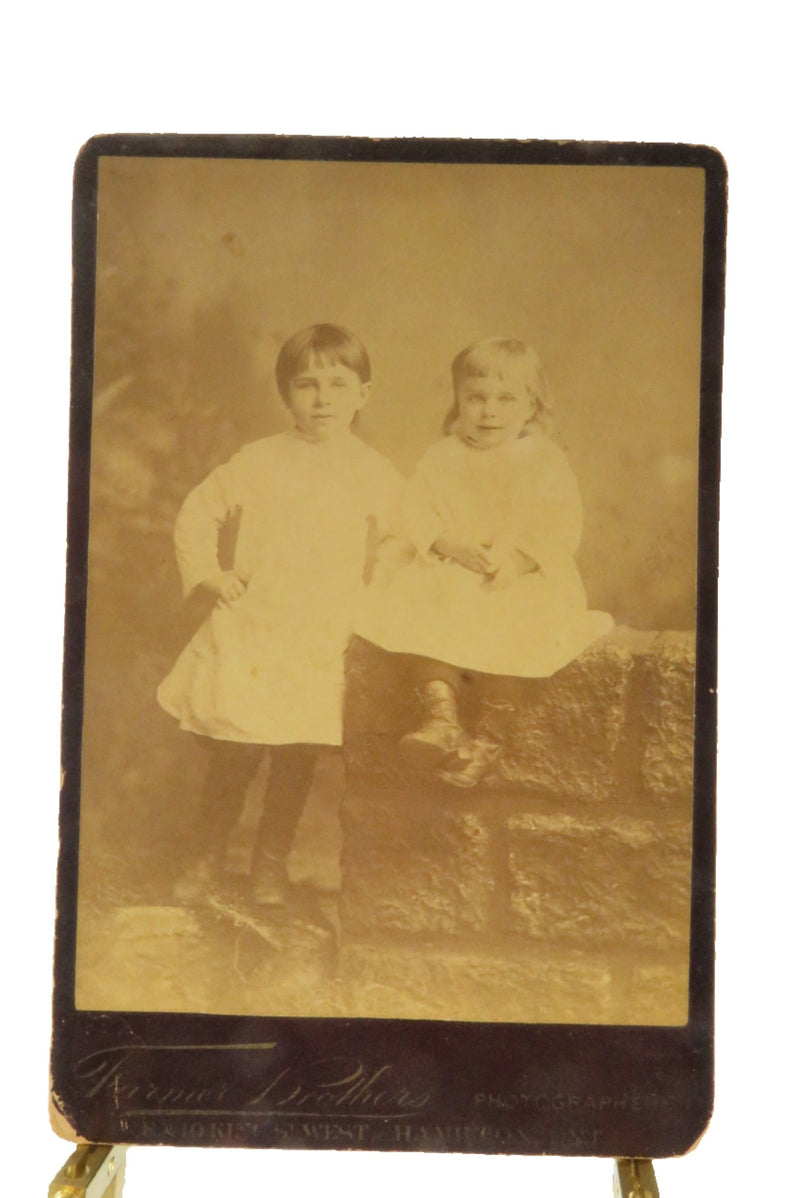 2 Cute Sisters One Sitting on Wall Antique Cabinet Card Farmer Brothers Ontario — front view