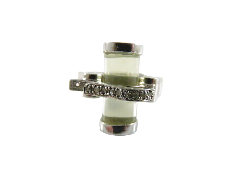 Silver ring with a central gemstone on a white background