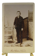Young Boy Wicker Chair Antique Cabinet Card Rise & Gates Lebanon PA — front view