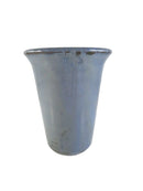 Blue ceramic cup on a white background