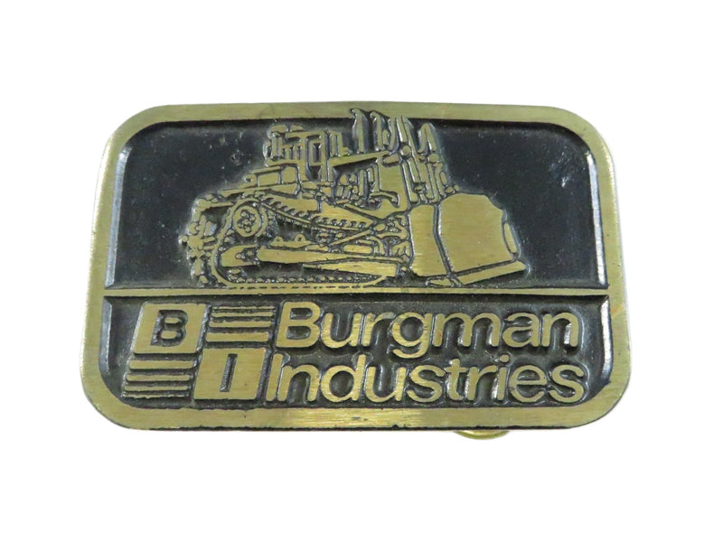 Burgman Industries belt buckle with bulldozer design on a white background