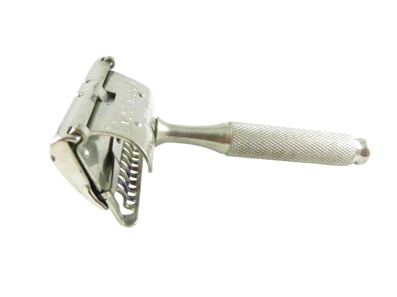 Vintage safety razor on a white background