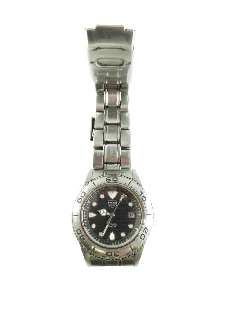 Wristwatch with a metallic band on a white background